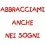 Cuscino con frase "Abbracciami anche nei sogni"